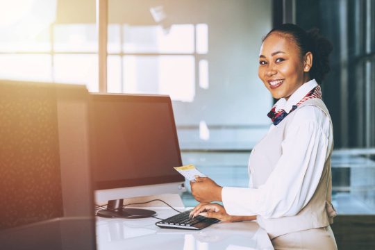 ground-hostess-airport-reception-airline-check-counter-staff-worker-happy-smiling (1)